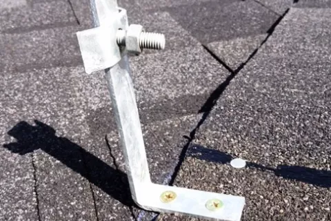 Conductor support for a shingle roof